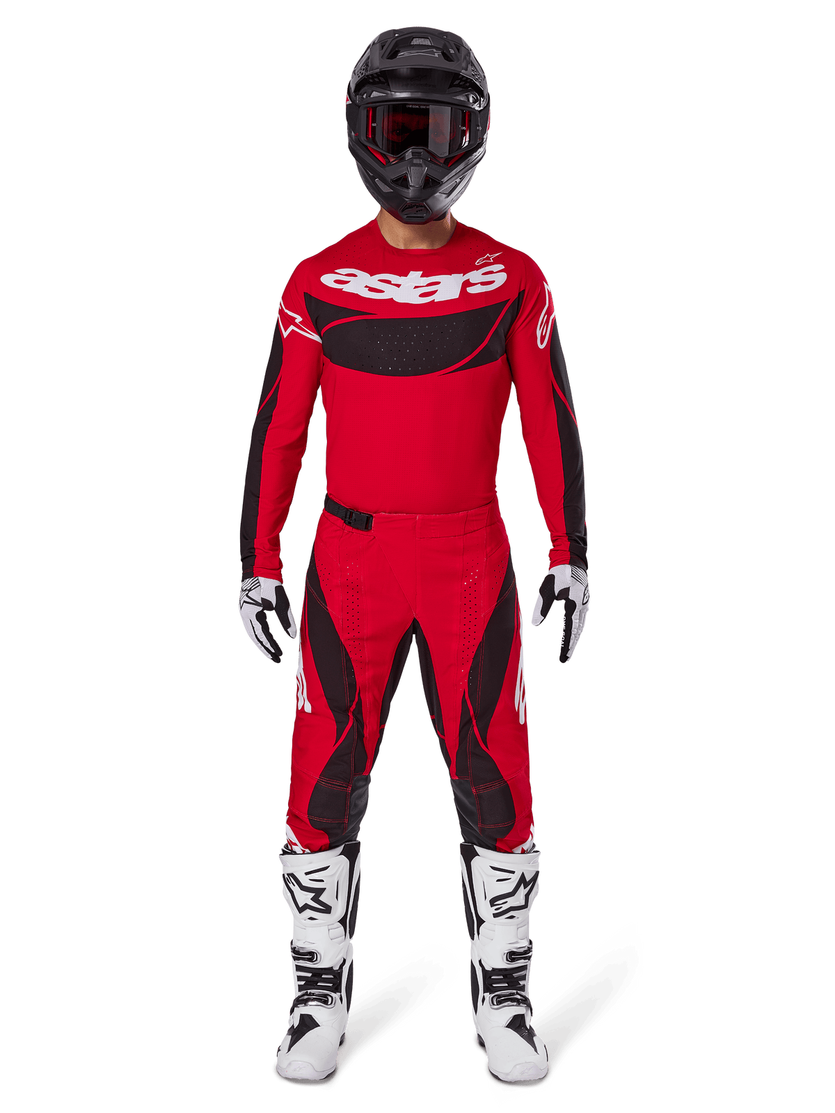 Alpinestars 2025 Techstar Dreem Gear Set, motorcrosser in helderrood jersey met zwarte panelen en witte 'astars' branding, bijpassende rode en zwarte broek, zwarte helm, witte en zwarte laarzen en handschoenen, complete outfit voor off-road competitie