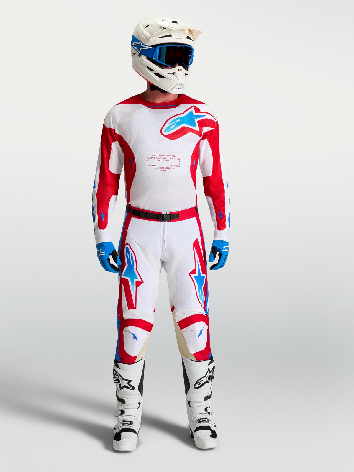 Alpinestars Racer Hunt, pantalons de motocross pour homme, blancs et rouges avec accents bleus, coupe ergonomique pré-courbée.