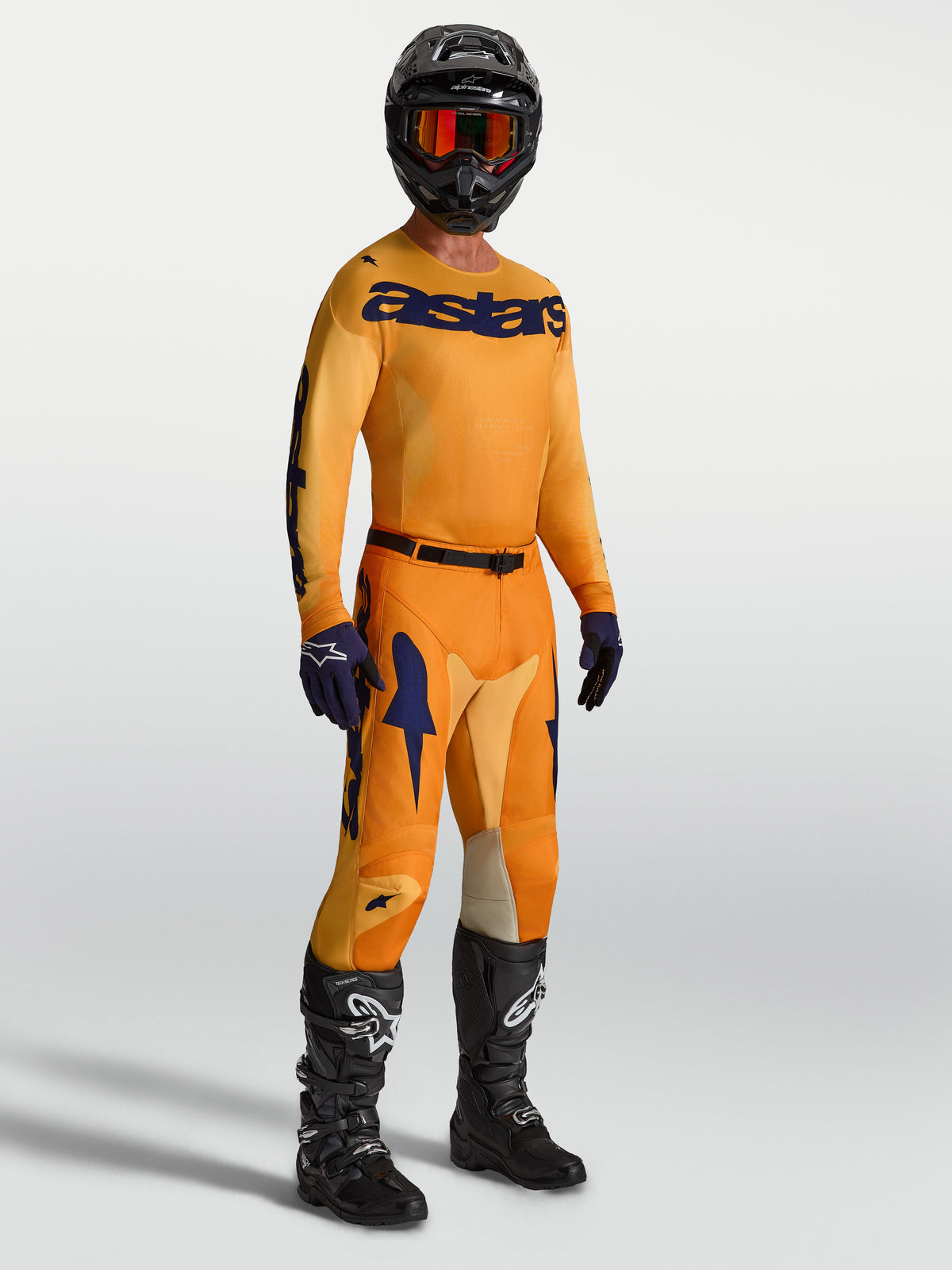 Alpinestars 2027 Racer Amber Motocross Gear Set, Men's orange and deep blue performance jersey with matching pants.
