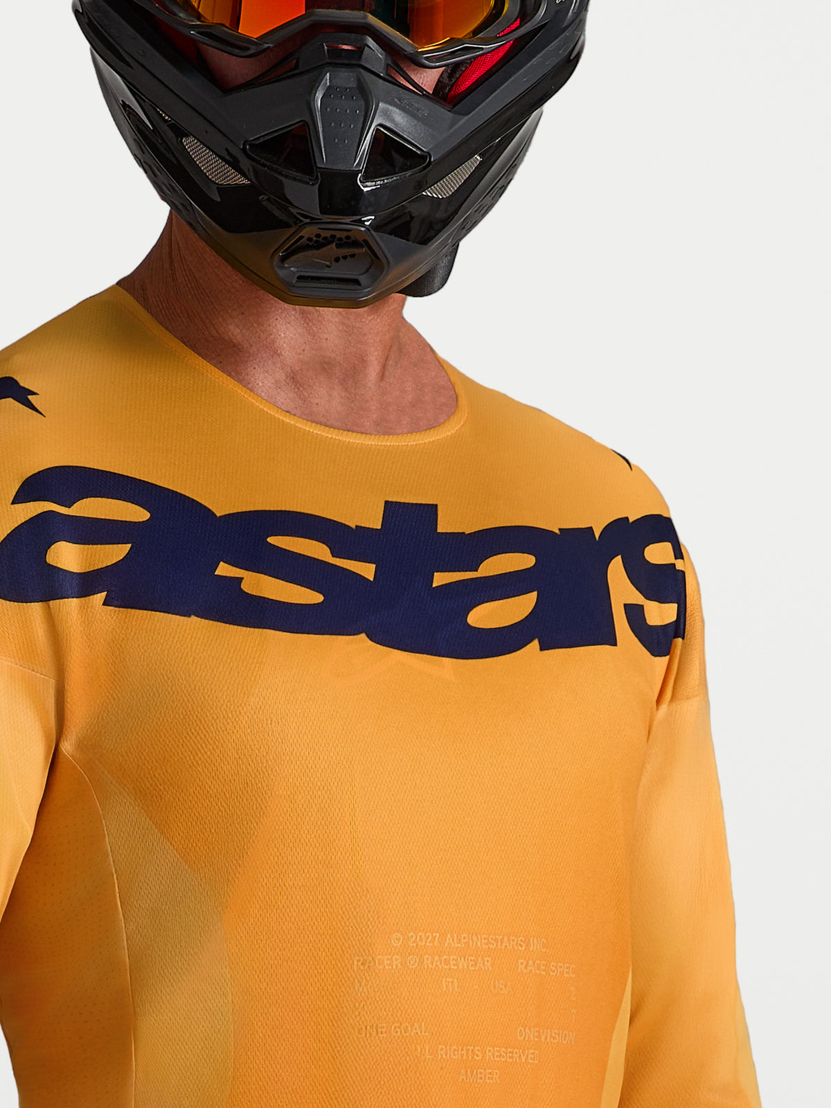 Maillot Racer Amber Alpinestars orange et bleu foncé, maillot de motocross respirant avec logo Astars sur la poitrine.
