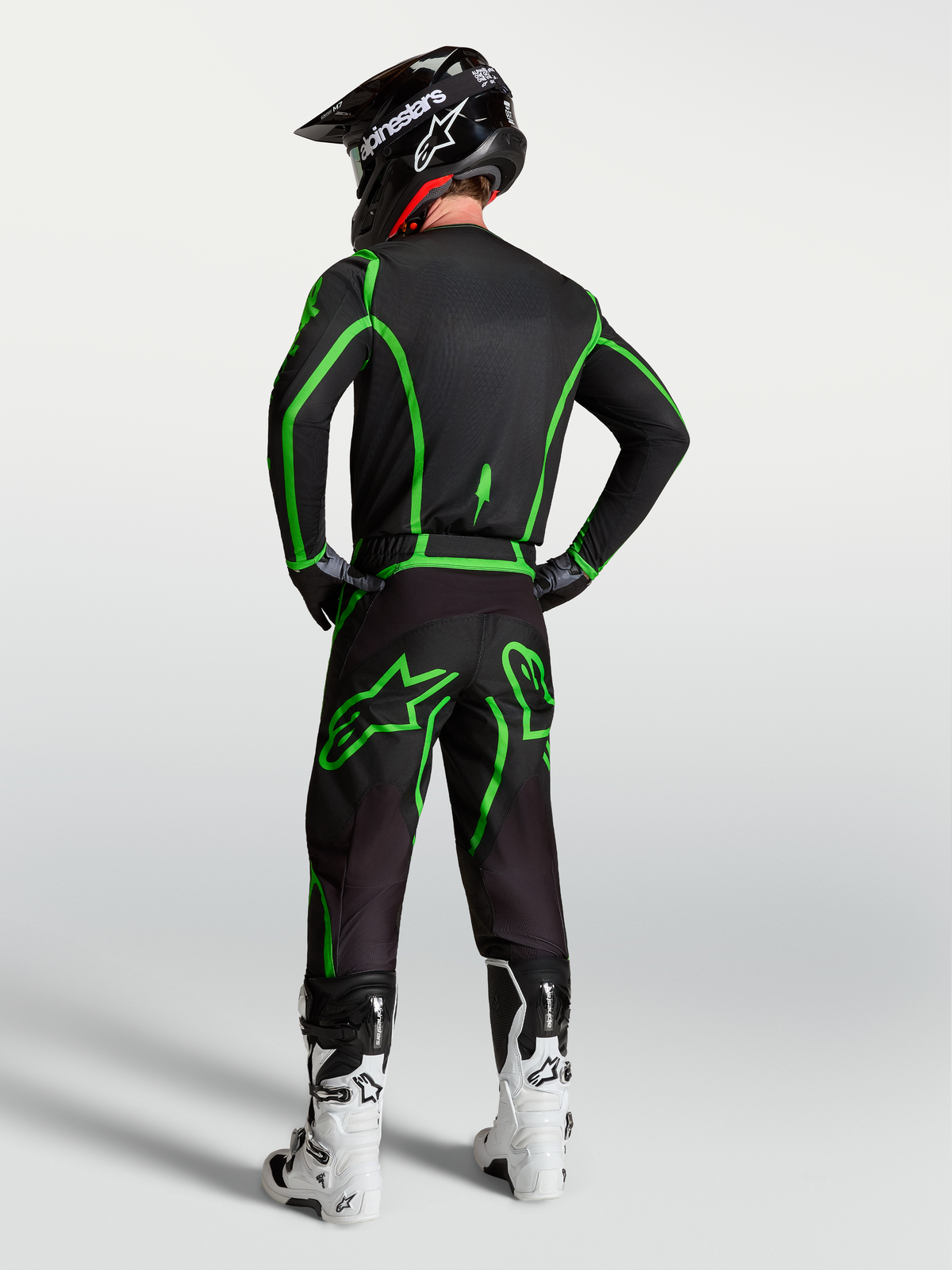 Pantalons Alpinestars Fluid Apex V2, motocross pour homme, noirs et vert fluo, coupe ergonomique avec équipement complet.