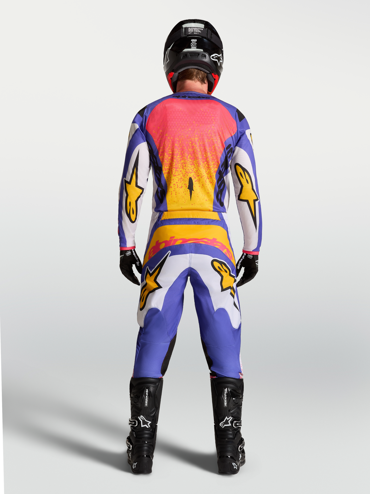 Alpinestars Fluid Drag, pantalon et ensemble de motocross pour homme lilas et bleu iris doré, vue de dos sur mannequin.
