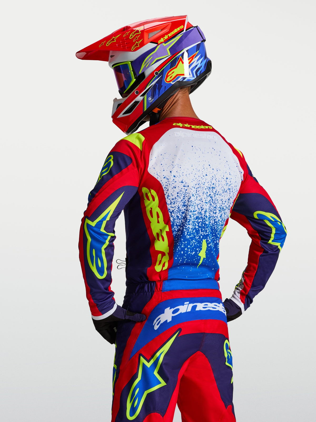 Alpinestars maillot Fluid Drag, maillot de motocross pour homme, bleu et rouge, vue de dos, tissu léger et respirant.