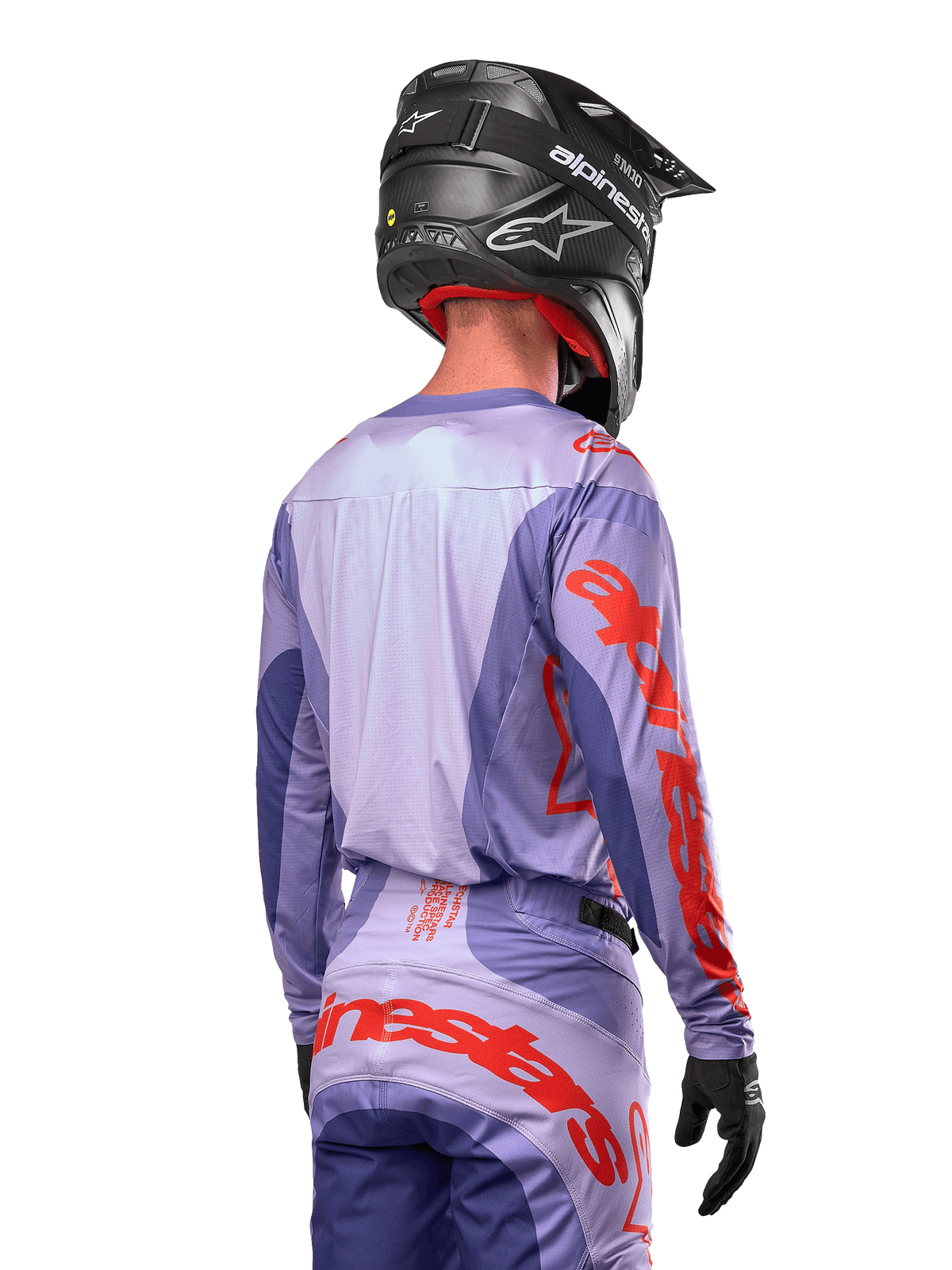 Alpinestars 2024 Techstar Ocuri Jersey, Motocross Jersey, Purple and Hot Orange, rear view on a rider wearing matching gear and a black helmet, featuring large orange Alpinestars lettering on the sleeves and lower back
