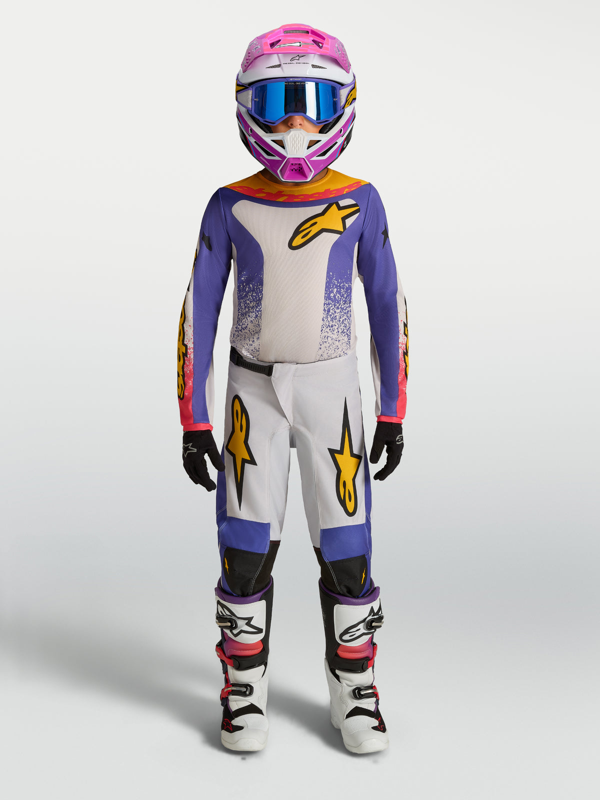 Alpinestars maillot et ensemble Fluid Drag Junior 2027, tenue de motocross pour enfant, violet et blanc avec accents dorés.