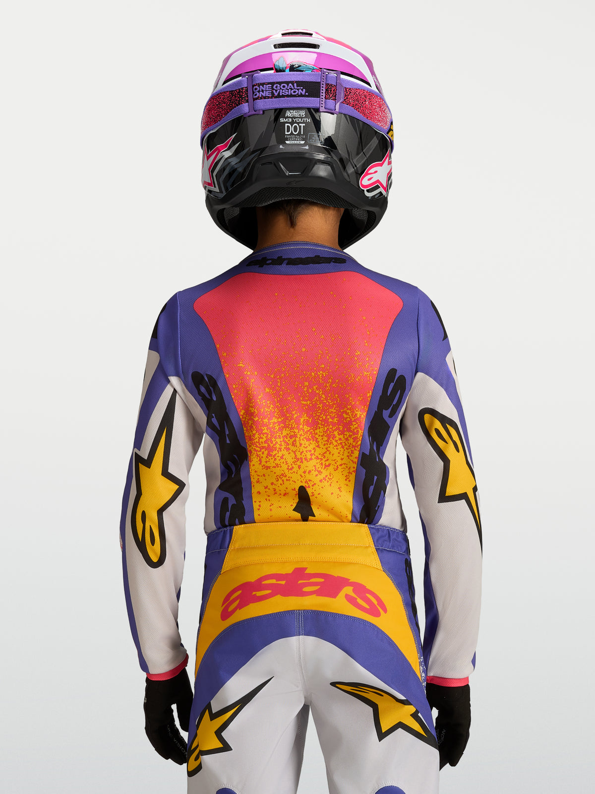 Maillot Fluid Drag Junior 2027 Alpinestars, motocross pour enfant, bleu et jaune, vue de dos avec graphismes de course.