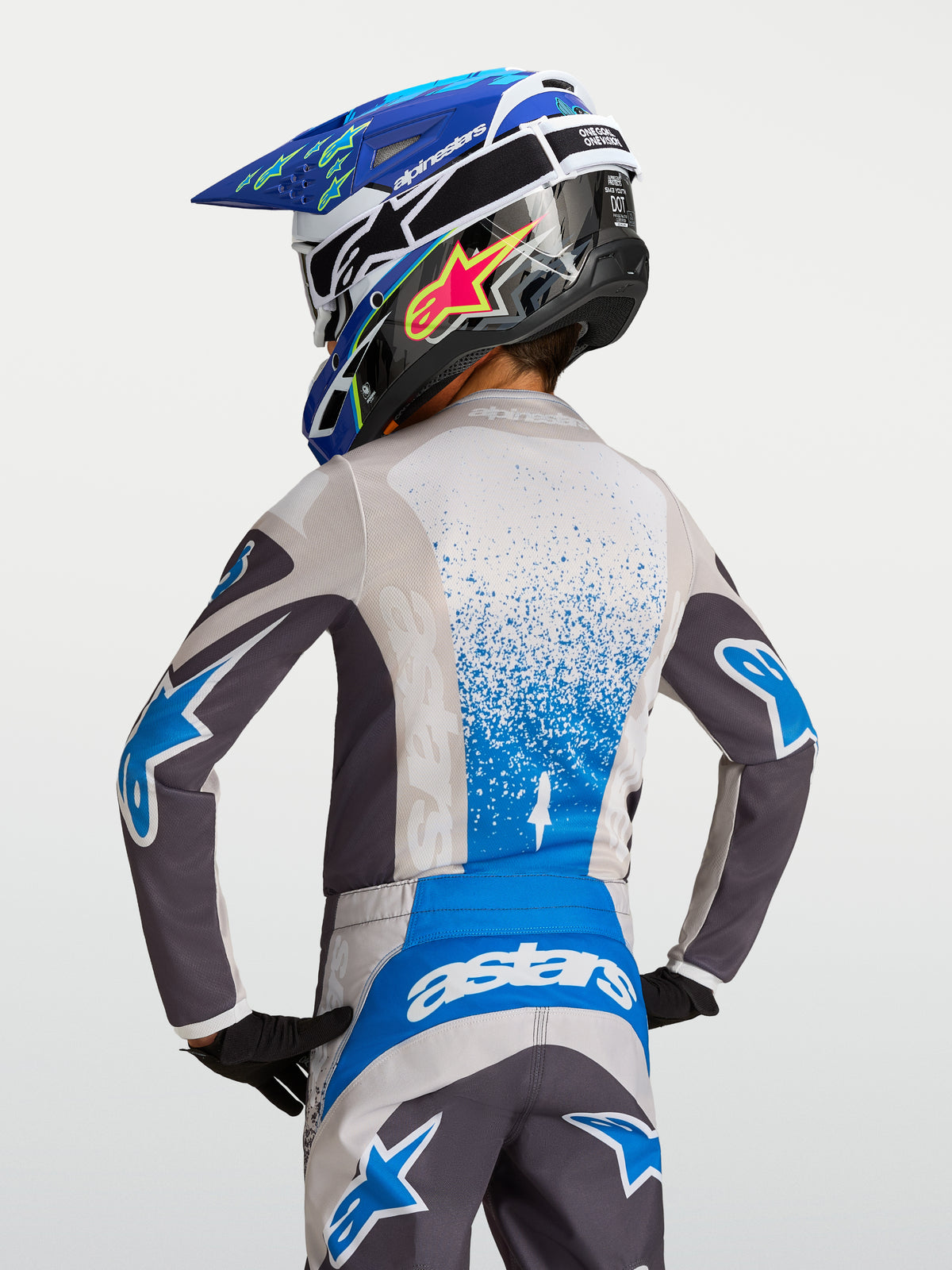 Alpinestars Youth Fluid Drag Jersey, gray and blue motocross racing gear for kids, moisture-wicking performance fabric.