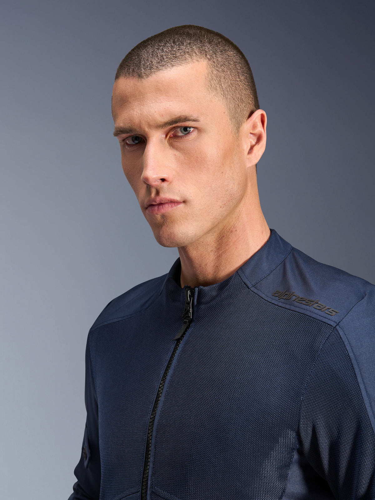Alpinestars C-1 Air Jas, blauwe heren urban motorjas van tech-mesh textiel met subtiele branding op de schouder.