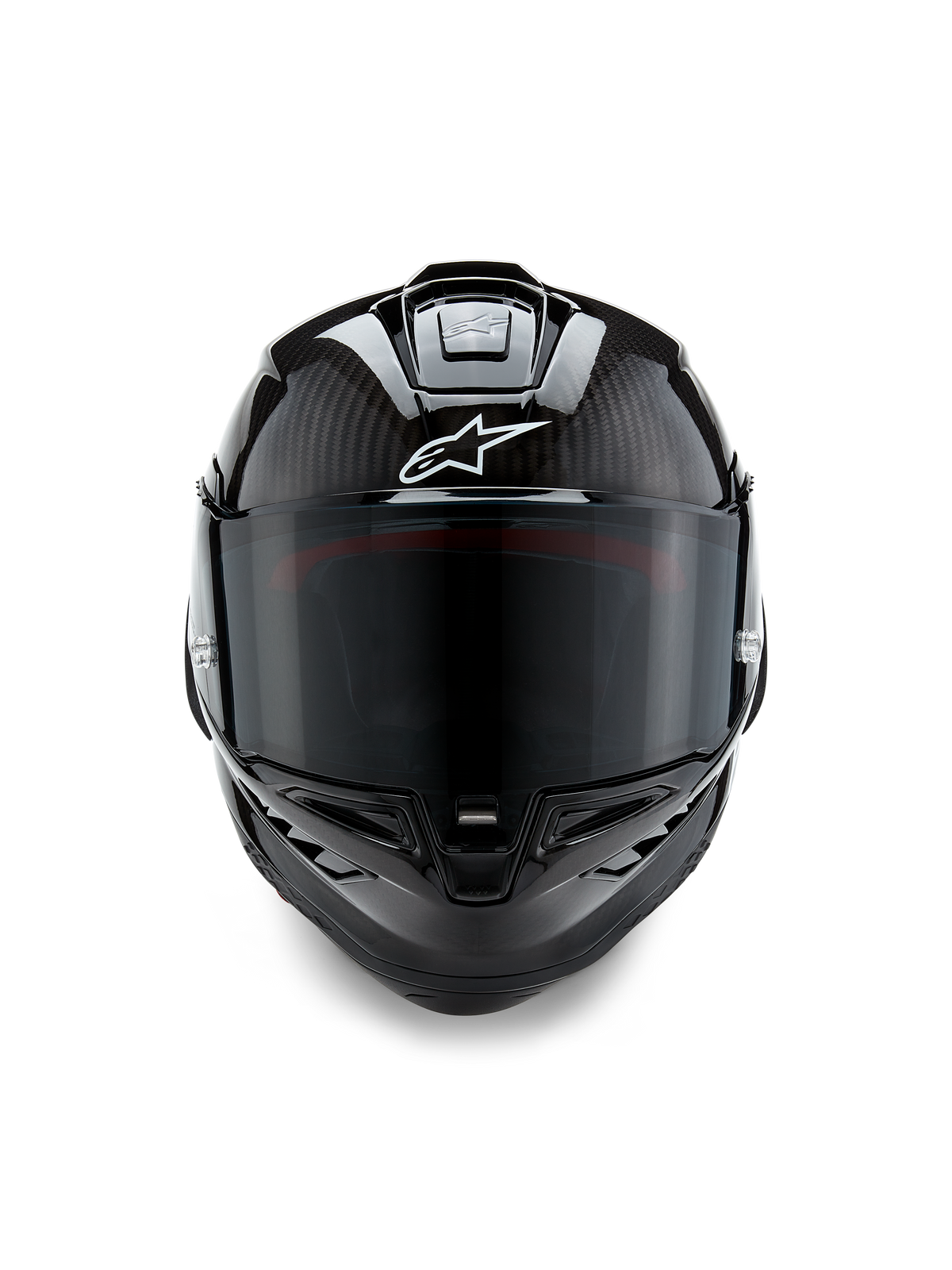 Alpinestars Supertech R10 Solid helm, vooraanzicht, mat en glanzende zwarte carbon afwerking, zichtbaar carbonweefsel, wit Alpinestars-logo, donker getint vizier, aerodynamische motorracehelm