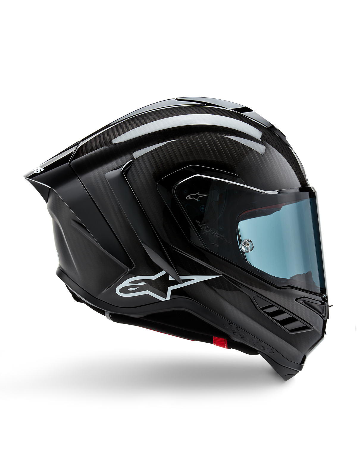 Alpinestars Supertech R10 Solid helm, zwart carbon mat en glanzend, motorracehelm, koolstofvezelconstructie, zijprofiel, blauw getint vizier, aerodynamisch ontwerp met winglets, wit logo, hoogwaardige bescherming op MotoGP-niveau