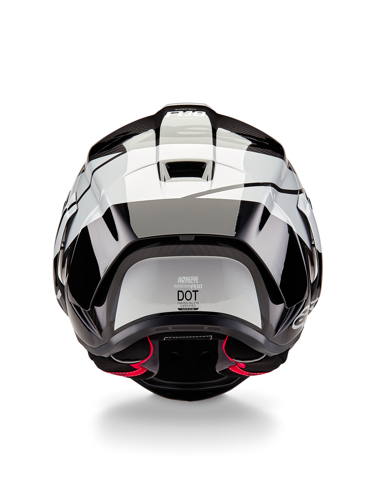 Alpinestars Supertech R10 Element Helm, achteraanzicht, zwart carbon zilver zwart glanzend, met aerodynamisch spoilerontwerp, DOT-certificeringslabel en rode accenten in de binnenvoering, professionele race-hoofdbescherming