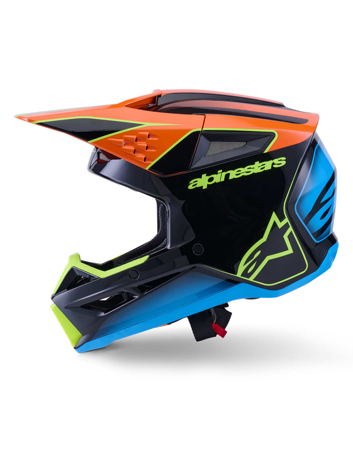 Alpinestars S-M3 Fray Helm ECE 22.06, Motocross-Helm, Schwarz mit orangefarbenen, blauen und neongelben Akzenten, Seitenprofil mit aerodynamischer Schale und integrierten Belüftungsöffnungen, markantes Alpinestars-Branding, professioneller Offroad-Rennschutz