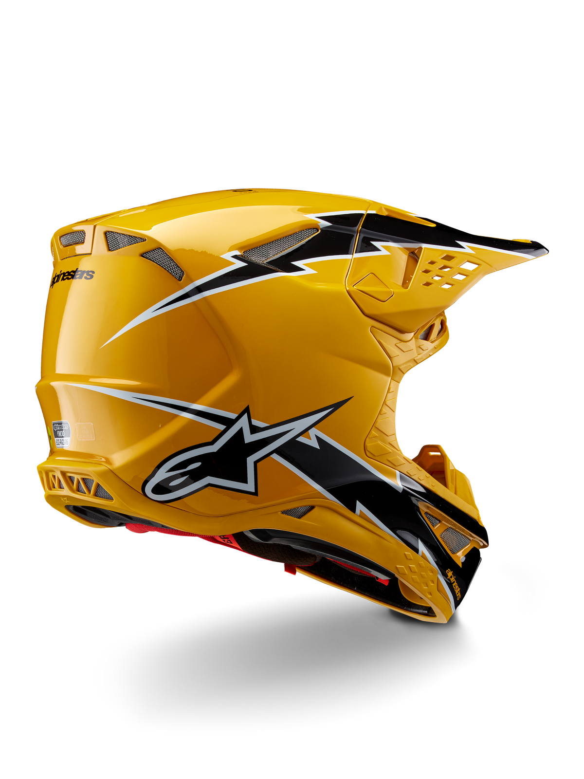 Alpinestars Supertech M10 Ampress Helmet, Motocross Helmet, Black Yellow Glossy, featuring a high-gloss yellow finish with black and white lightning-style graphics, rear three-quarter view showing aerodynamic shell and integrated ventilation ports.