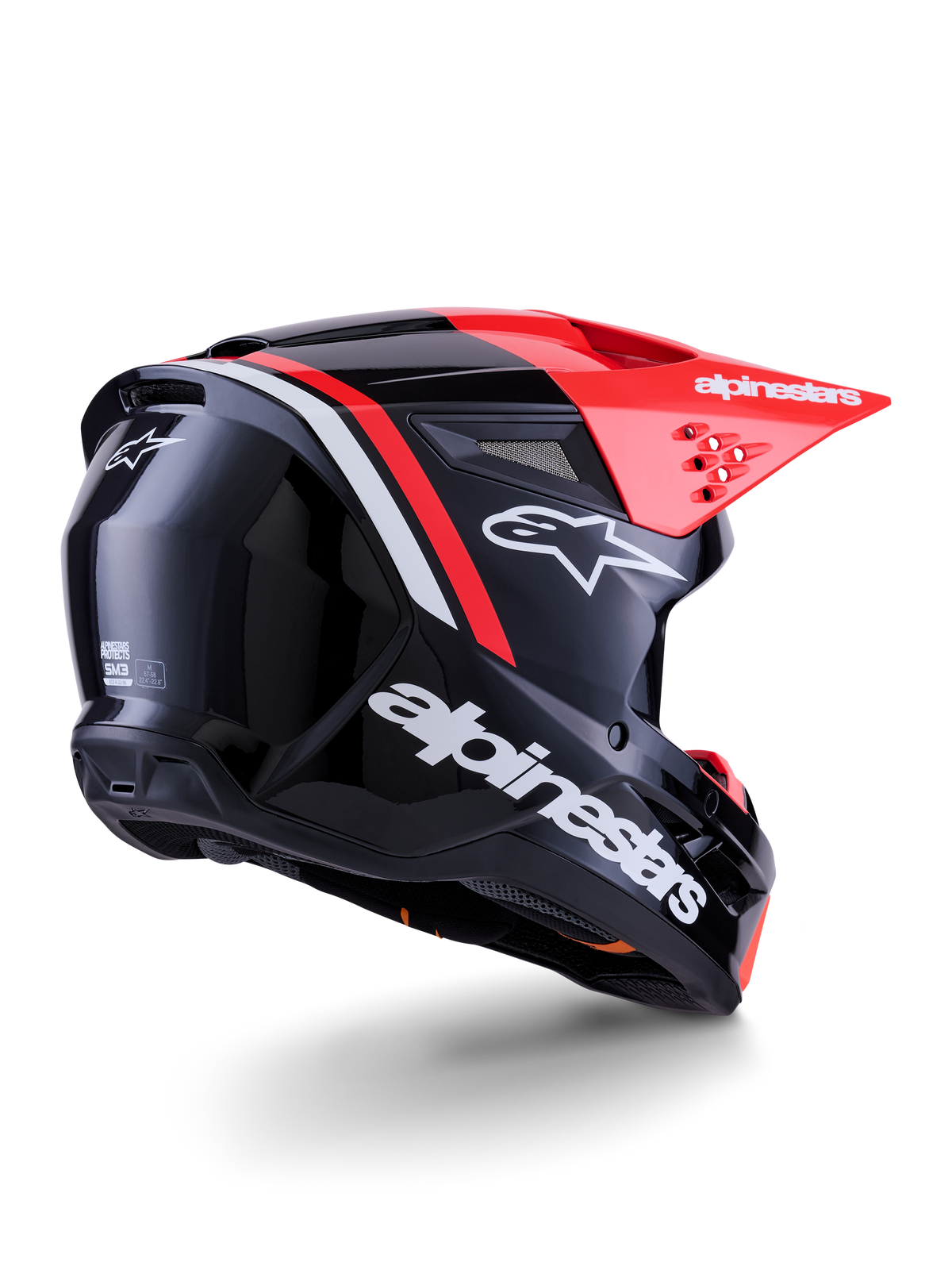 Alpinestars S-M3 Radium Helm, Motocross-Helm, Schwarz, Fluo-Rot und Weiß Glänzend, Rückansicht in Dreiviertel-Perspektive zeigt schlankes aerodynamisches Design, weißes Branding und leuchtend rotes Visier, Hochleistungs-Offroad-Schutzkopfbedeckung