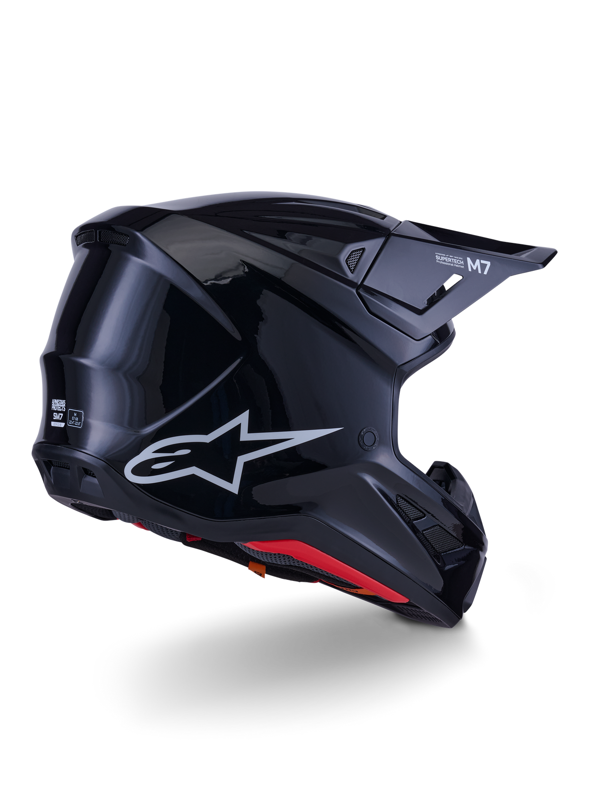 Alpinestars S-M7 Solid Helm, Motocross-Helm, Glänzend Schwarz, mit einer schlanken aerodynamischen Schale, silbernem Astars-Logo, rotem Innenfutter und integrierten Belüftungsöffnungen, entwickelt für den Schutz im Offroad-Rennsport