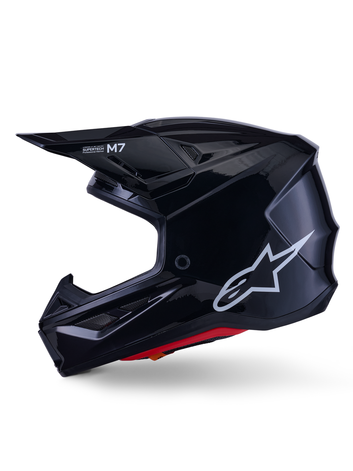 Alpinestars S-M7 Solid Helm, Motocross-Helm in glänzendem Schwarz, Seitenprofil mit weißem Alpinestars-Logo, aerodynamische Schale mit Belüftungsgittern und roter Innenpolsterung, fortschrittlicher Offroad-Schutz