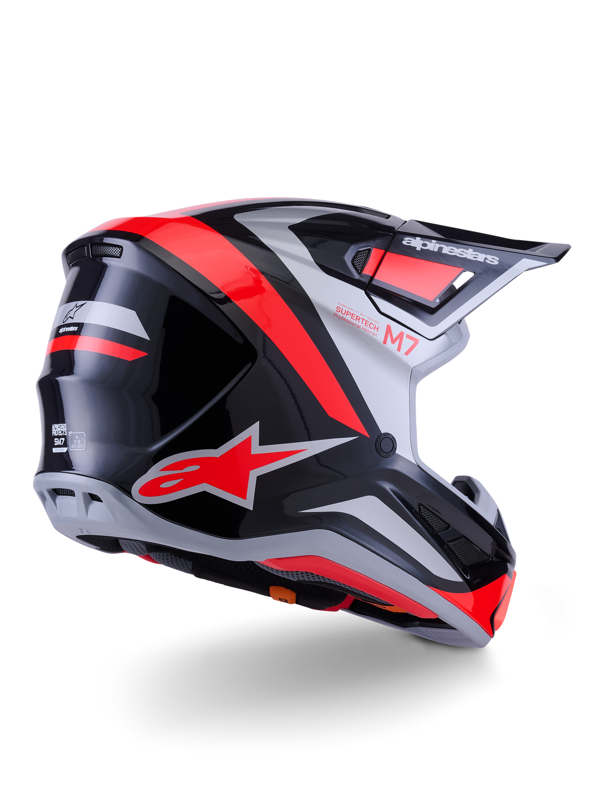 Alpinestars S-M7 Rise Helm, Motocross-Helm, Schwarz, Silber und Fluo-Rot Glänzend, Dreiviertel-Rückansicht, mit markantem rotem A-Star-Logo und silbernen Akzenten, aerodynamische Schale mit Visier, professioneller Offroad-Rennschutz