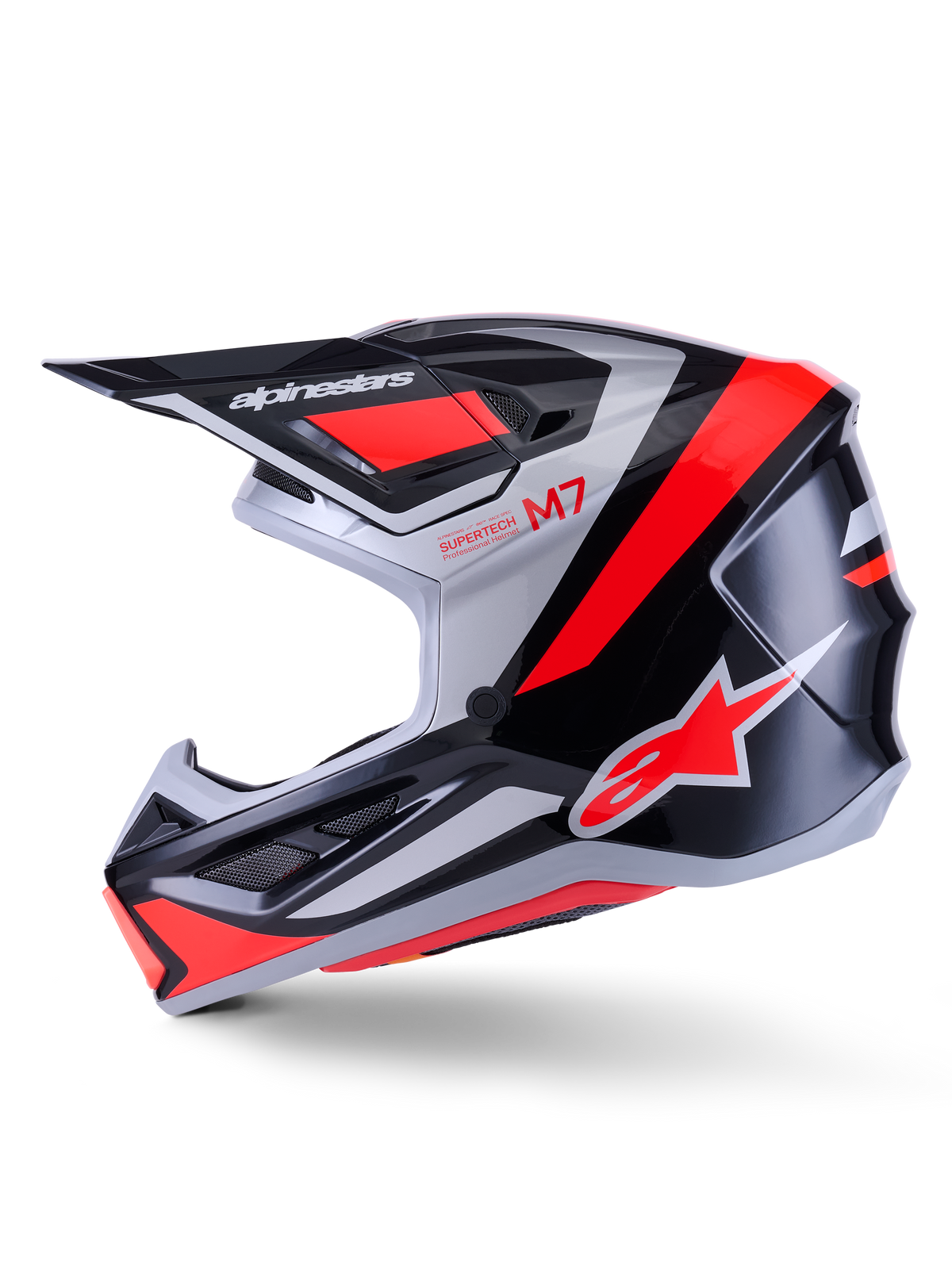 Alpinestars S-M7 Rise Helm, Motocross-Helm, Schwarz, Silber und Red Fluo Glänzend, Seitenprofil-Ansicht mit aerodynamischer Verbundschale, belüftetem Kinnschutz und markantem Helmschild mit Alpinestars-Branding.