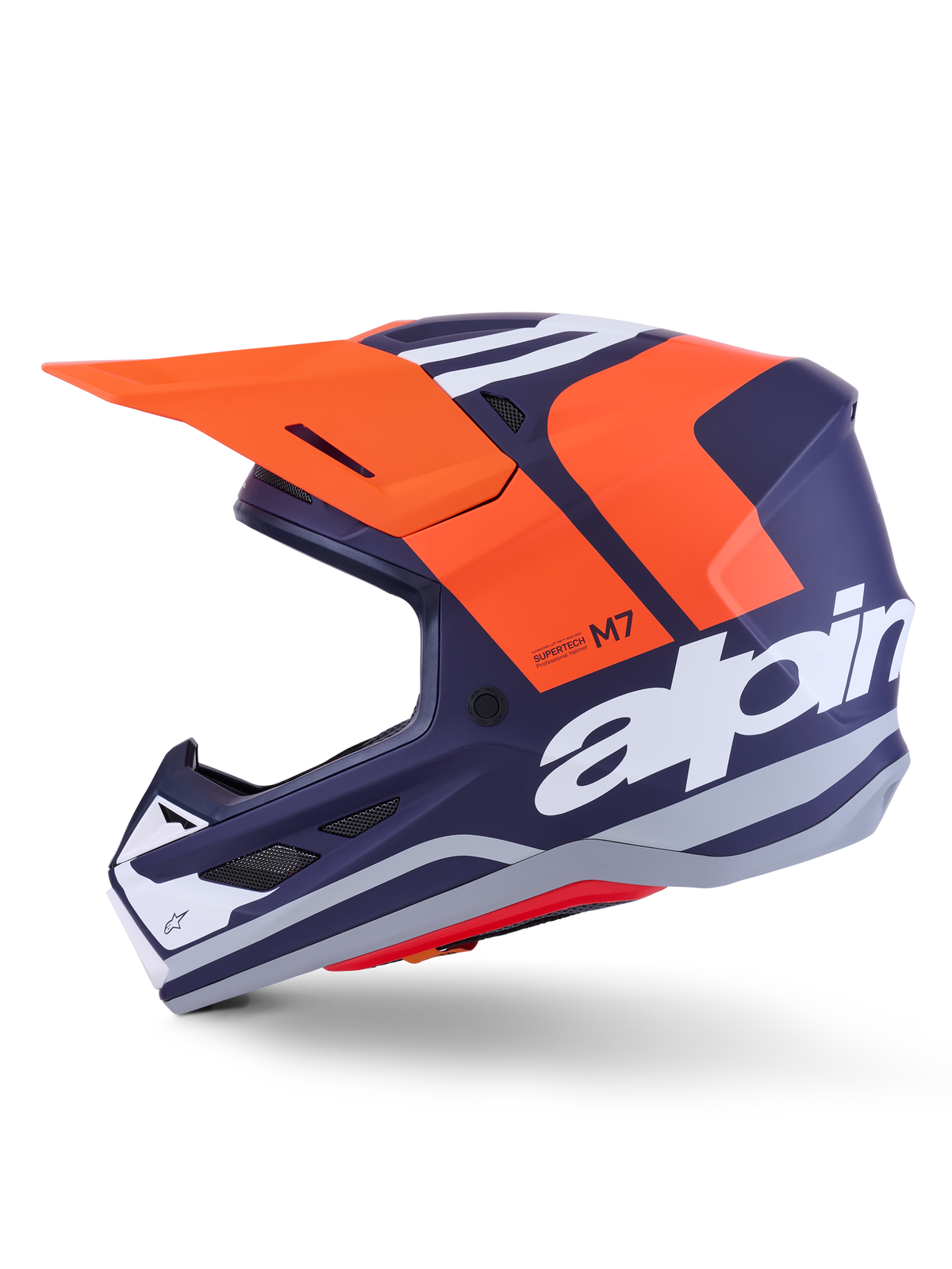 Alpinestars S-M7 Core Helm ECE 22.06, zijprofiel, mat donkerblauw en oranje afwerking, groot wit logo op de zijkant, aerodynamische motorcrosshelm met beschermend vizier