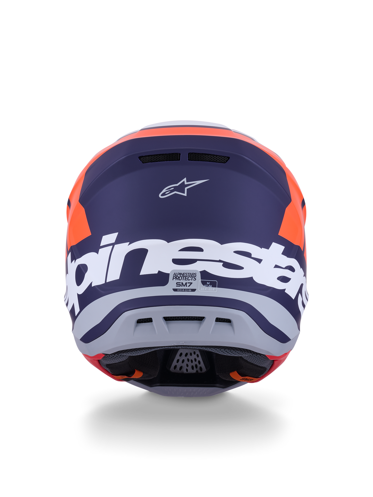 Alpinestars S-M7 Core Helm ECE 22.06, motorcrosshelm, mat oranje en blauw, achteraanzicht met grote witte Alpinestars-branding en Astars-logo, strak aerodynamisch ontwerp met geïntegreerde uitlaatpoorten, professionele off-road bescherming