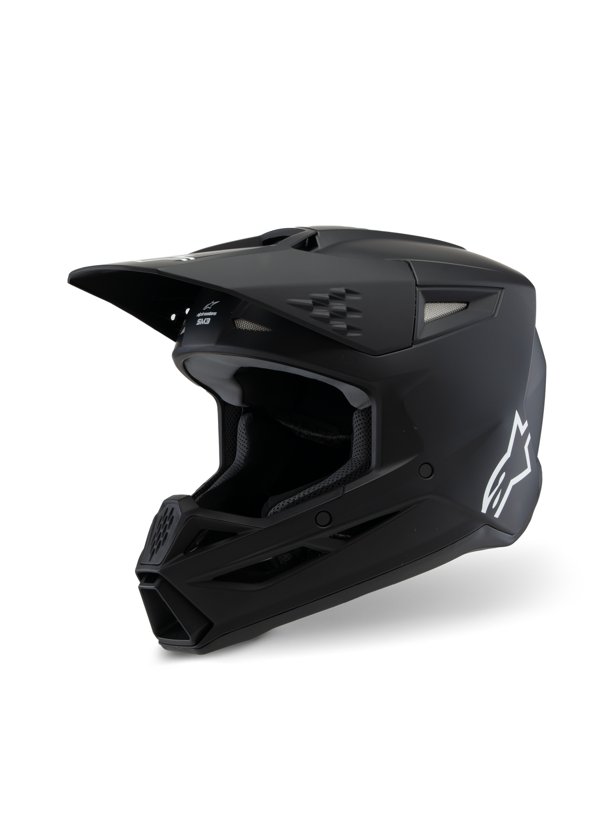 Alpinestars S-M3 Youth Solid Helmet ECE 22.06, casque de motocross, noir mat, vue de profil avec logo Alpinestars blanc, coque aérodynamique avec orifices de ventilation et visière intégrée, protection de tête professionnelle pour jeunes pilotes