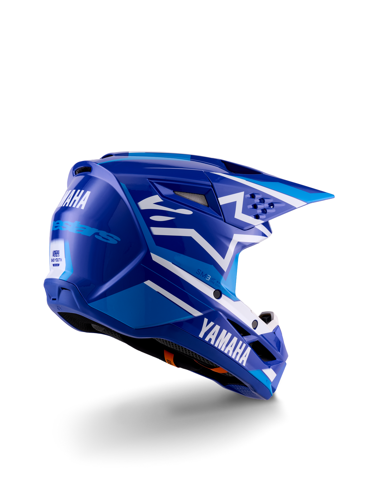Alpinestars Yamaha S-M3 jeugd motocrosshelm, blauw en wit glanzend, voorzien van opvallende Yamaha-branding op de zijkant en achterkant, aerodynamisch schaalontwerp met ventilatie aan de achterzijde, jeugdspecifieke off-road hoofdbescherming in een driekwart achteraanzicht.