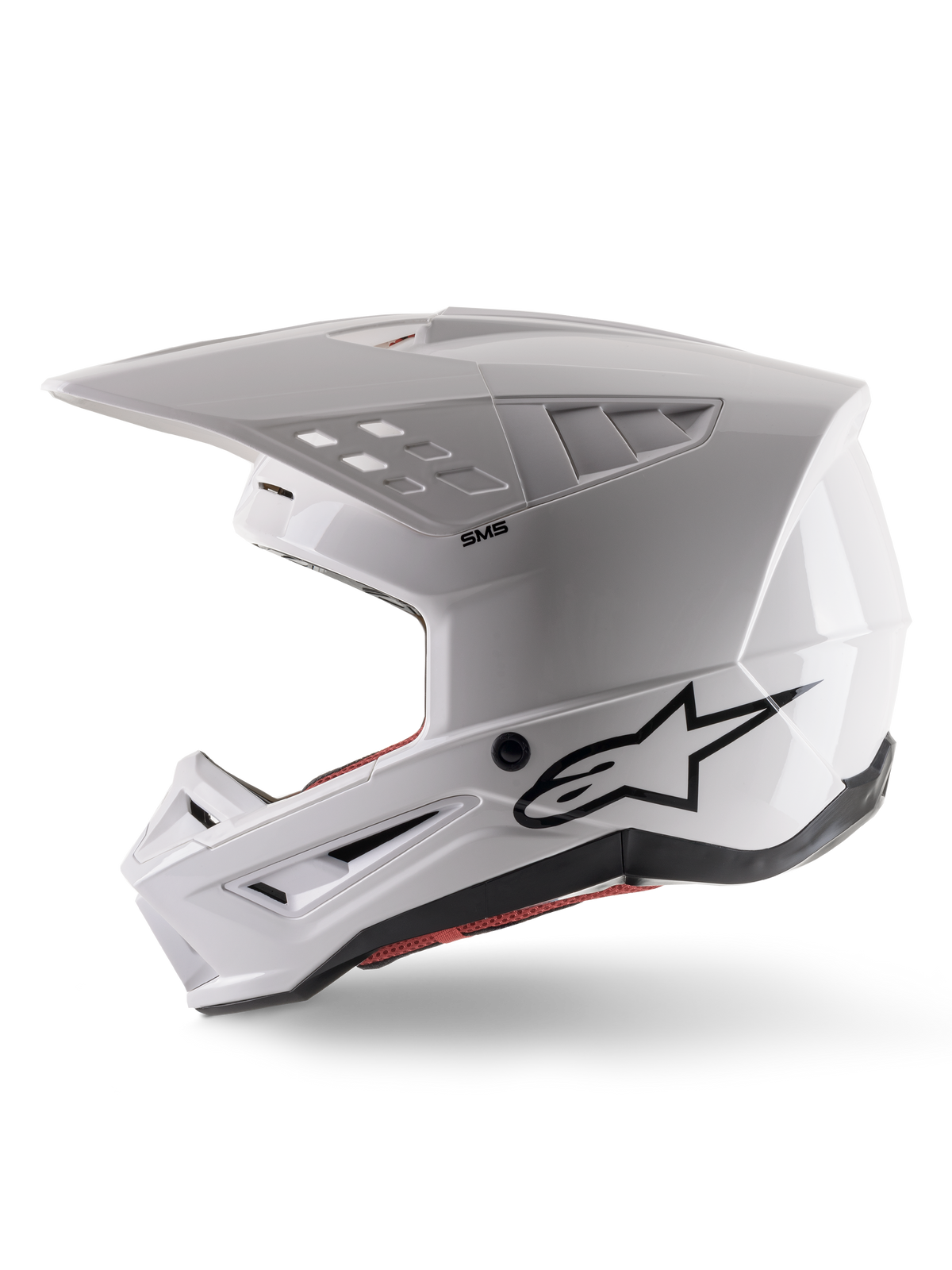 Alpinestars S-M5 Solid Helm ECE 22.06, motorcrosshelm, glanzend wit, zijaanzicht met hoekig helmschaalontwerp, zwart Alpinestars-logo op de zijkant, meerdere ventilatieopeningen en geïntegreerd vizier voor off-road racing.