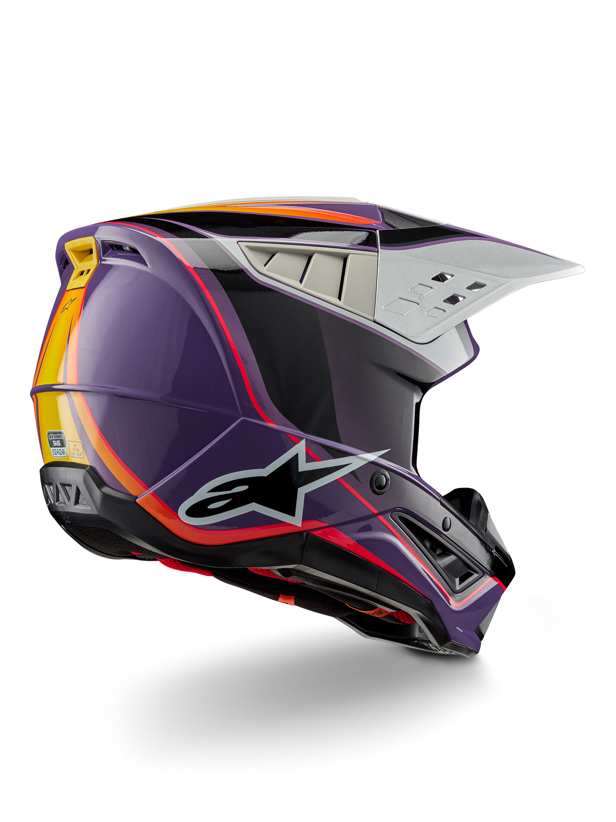 Alpinestars S-M5 Sail Helm ECE, motorcross helm, violet zwart zilver glanzend, voorzien van oranje en gele streepaccenten, groot zwart sterlogo, aerodynamisch profiel met ventilatieopeningen aan de achterzijde, glanzende afwerking voor off-road racen