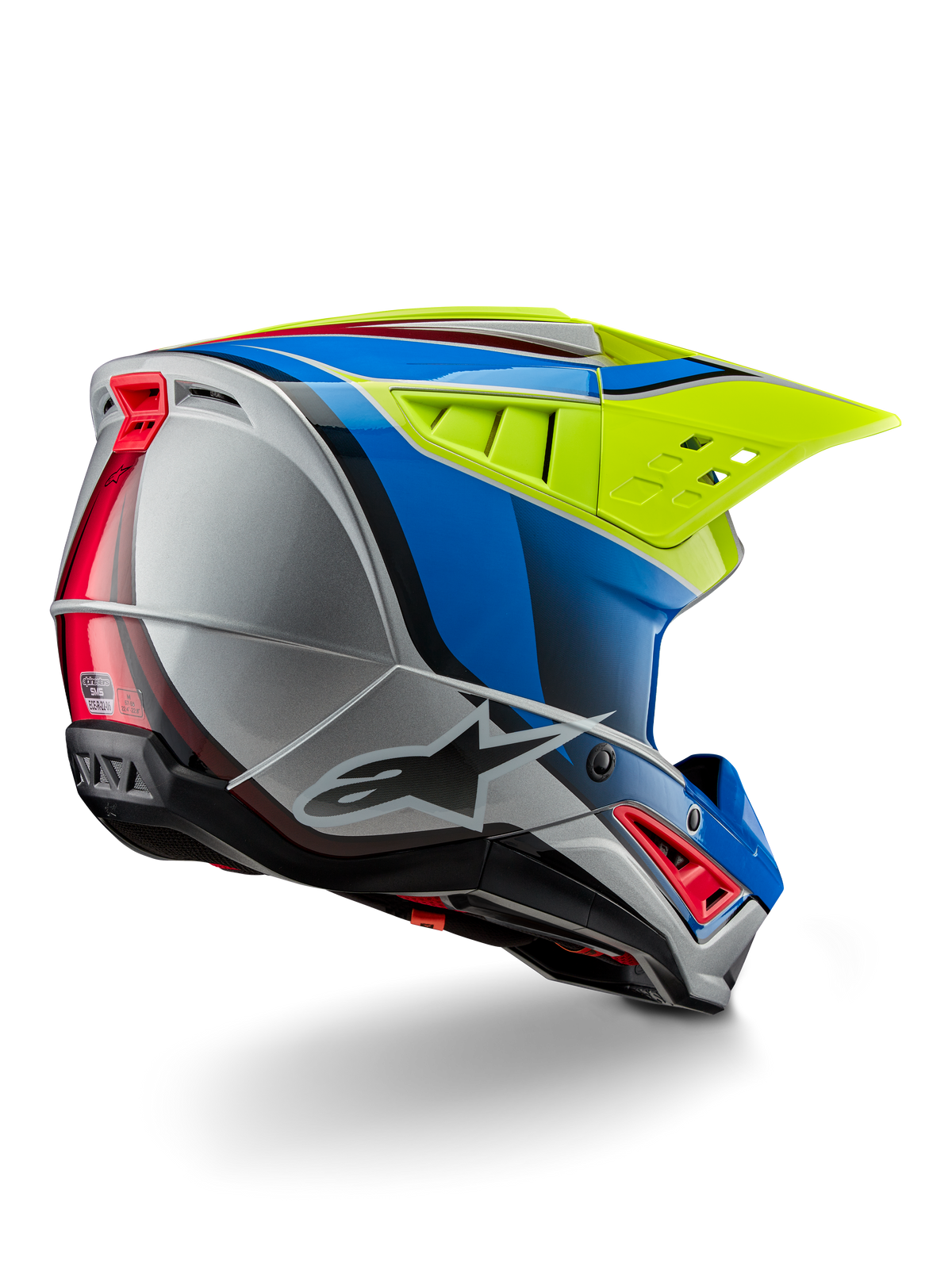 Alpinestars S-M5 Sail ECE helm, motorcrosshelm, Geel Fluo, Emailleblauw en Zilver Glanzend, driekwart achteraanzicht met aerodynamische thermoplastische schaal, groot geventileerd vizier en geïntegreerde ventilatieopeningen voor off-road bescherming.