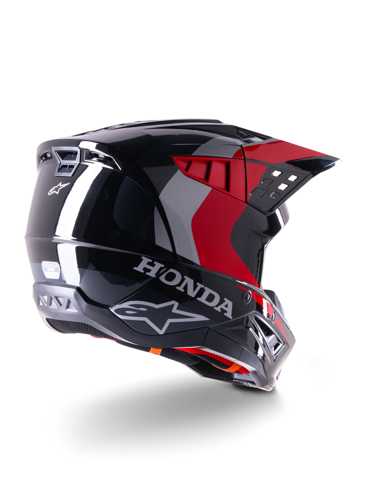 Casque Alpinestars Honda S-M5 ECE, casque de motocross, noir rouge brillant, vue de trois-quarts arrière avec marquage Honda et logos Alpinestars, finition brillante avec motifs graphiques rouges et gris, protection tout-terrain