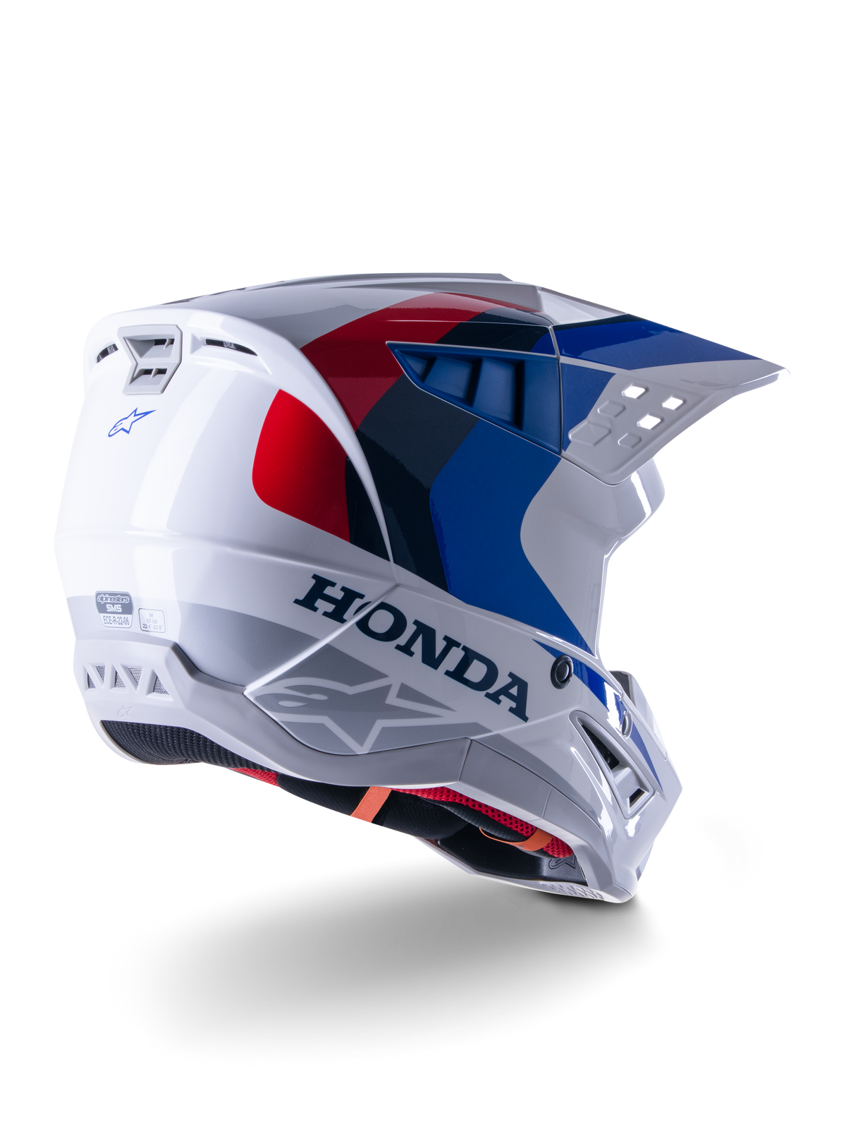 Alpinestars Honda S-M5 Helmet ECE, casque de motocross, blanc, bleu et rouge brillant, avec marquage Honda et logos Alpinestars, coque aérodynamique avec ports de ventilation intégrés et visière réglable, équipement de protection pour la course tout-terrain