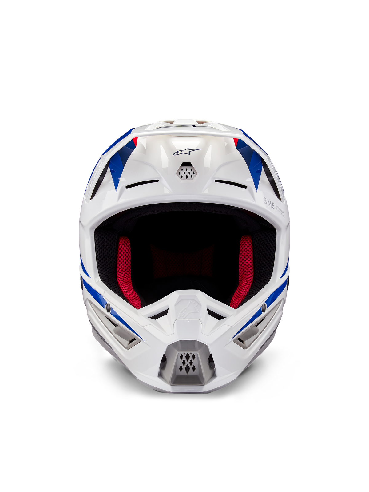 Casque Alpinestars Honda S-M5 ECE, casque de motocross, blanc, bleu et rouge brillant, vue de face montrant les ports de ventilation et le rembourrage intérieur rouge, design aérodynamique pour la protection en course tout-terrain