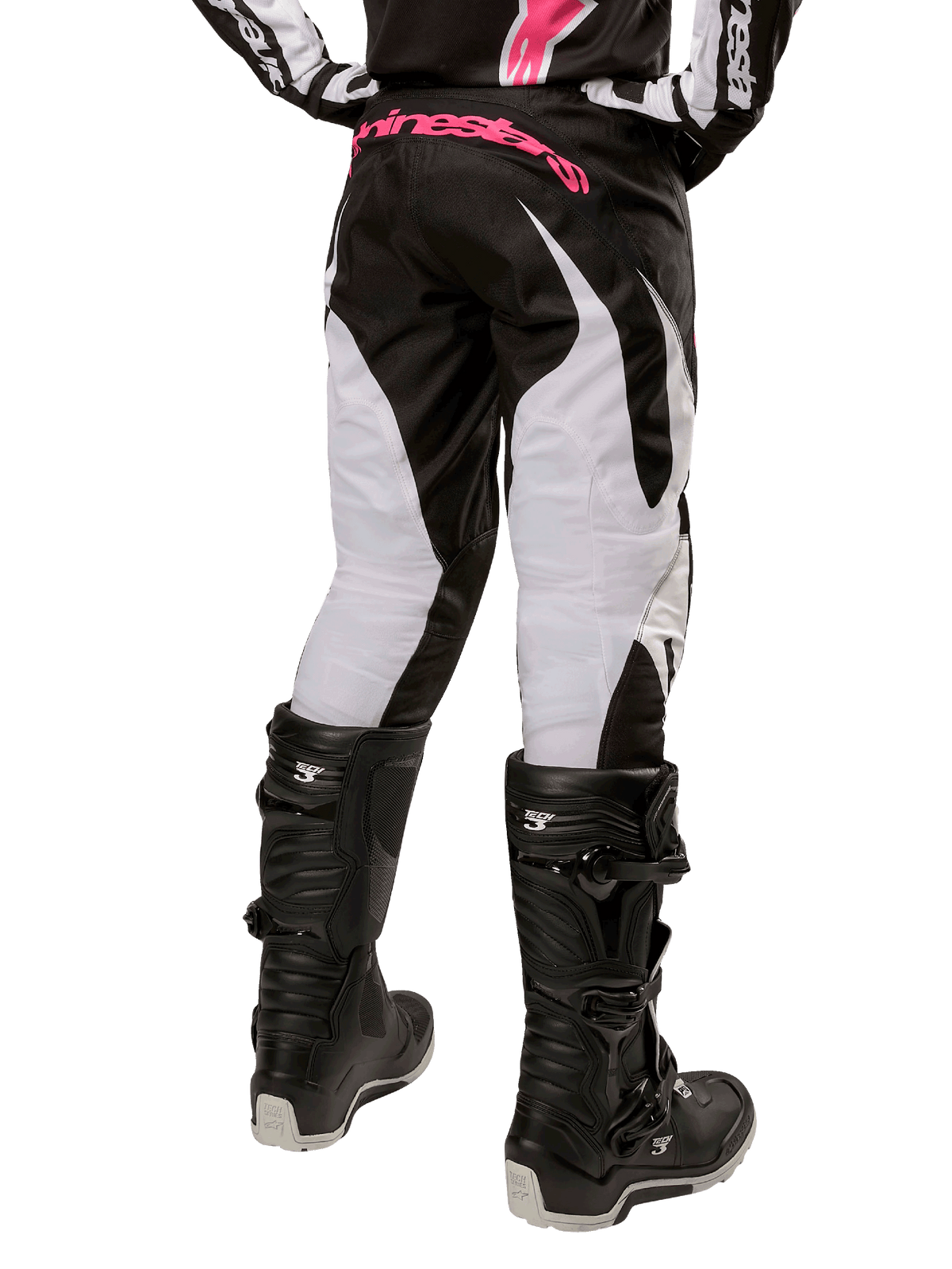 Alpinestars Women Stella 2024 Fluid Pant, Motocross Pants, Black and White, back view showing white leg panels and pink branding on waistband, worn with black Tech 3 boots, durable gear for off-road racing