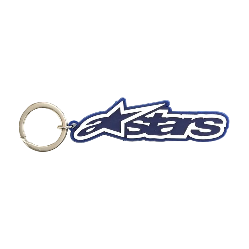 Alpinestars porte-clés Blaze, accessoire de sportswear, bleu et blanc, construction en caoutchouc 3D avec logo et anneau métallique, inspiré par la course automobile