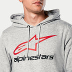 Alpinestars Always V3 Kapuzenpullover, Grau Meliert, Nahaufnahme der Brust mit rotem Stern-Logo und schwarzem Alpinestars-Schriftzug, jersey-gefütterte Kapuze mit grauen Kordelzügen, lässige Motorsport-Streetwear