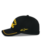 Alpinestars Luminary Hat, Black snapback cap shown from the side, yellow 3D embroidery on the front and side, curved bill with yellow sutache trim, structured cotton twill construction