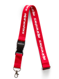 Alpinestars Linear sleutelkoord, rood en wit, voorzien van bedrukt Alpinestars woordlogo, zwarte veiligheidsclip en afneembare metalen draaiclip, op motorsport geïnspireerd accessoire
