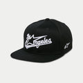 Alpinestars Los Angeles pet, snapback cap met platte klep, zwart en wit, 3D geborduurd atletisch lettertype met Astars-logo, gestructureerde kroon, casual motorsport streetwear