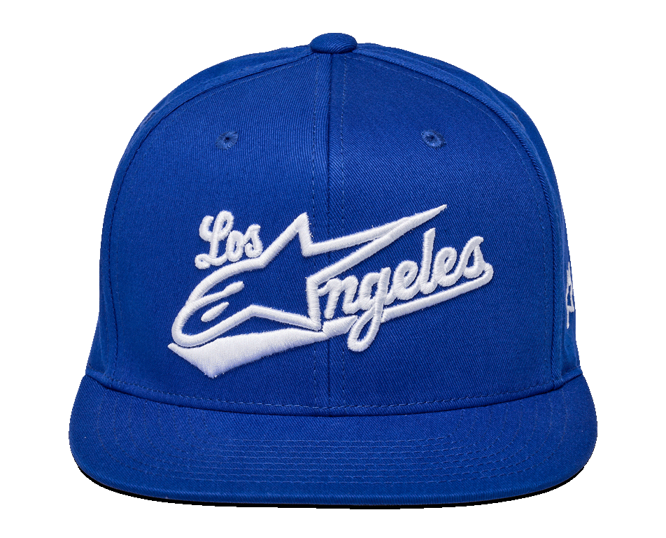 Alpinestars Los Angeles pet, blauwe snapback cap, wit 3D-borduurwerk met sportief 'Los Angeles' lettertype en Ageless-logo, gestructureerde kroon, platte klep, casual sportswear streetwear.