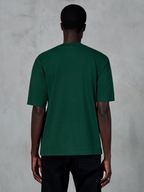 T-shirt Alpinestars Essentials Ageless SS, t-shirt à manches courtes, vert sapin, vue de dos sur mannequin, coupe décontractée, coton biologique, streetwear décontracté d'inspiration sport mécanique