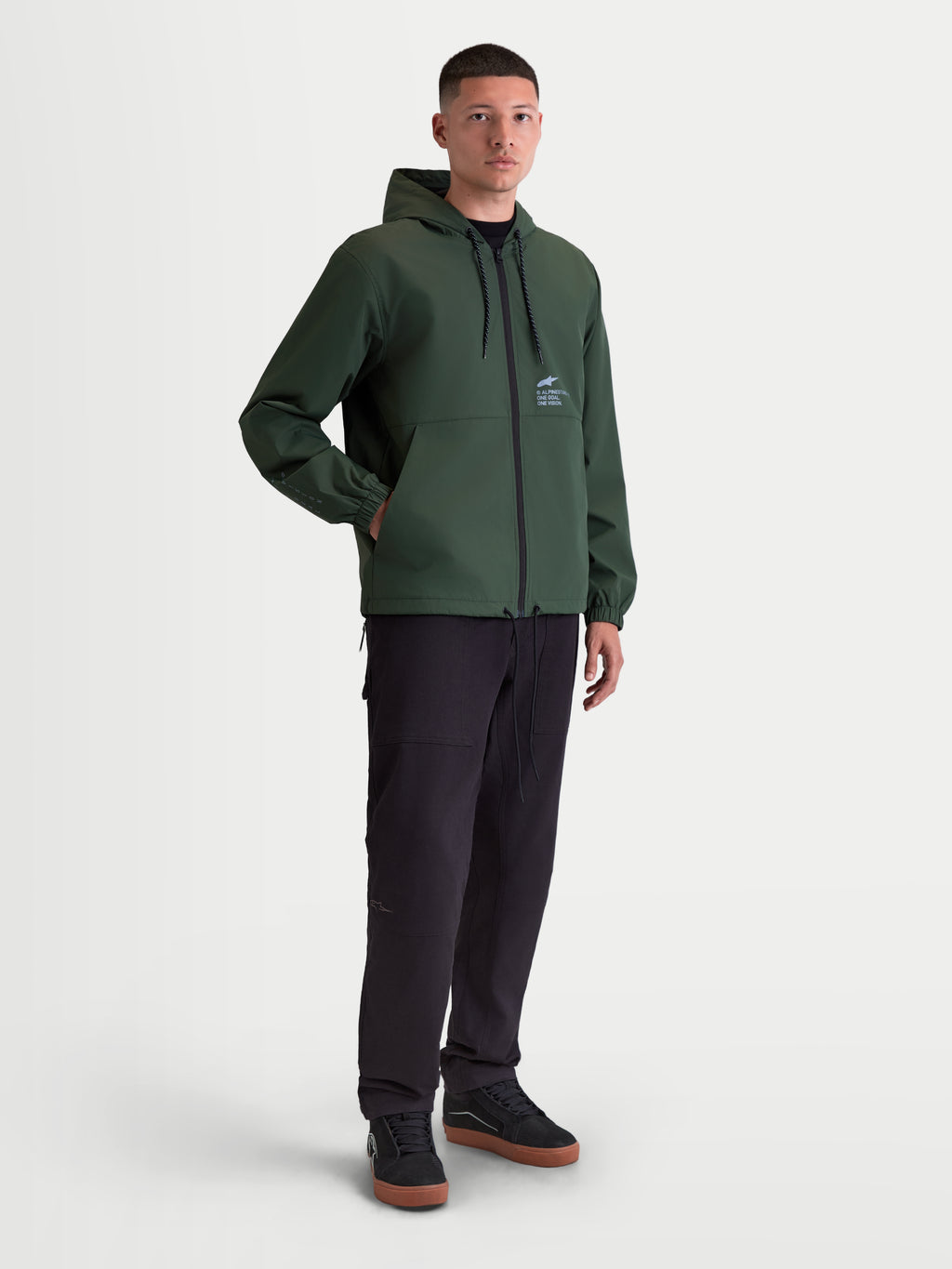 Alpinestars veste coupe-vent Speeder Resolve, veste sportswear légère pour homme, vert pin, dotée d'une capuche et d'un ourlet réglables, avec poches pour les mains et logo Alpinestars sur la poitrine, style urbain