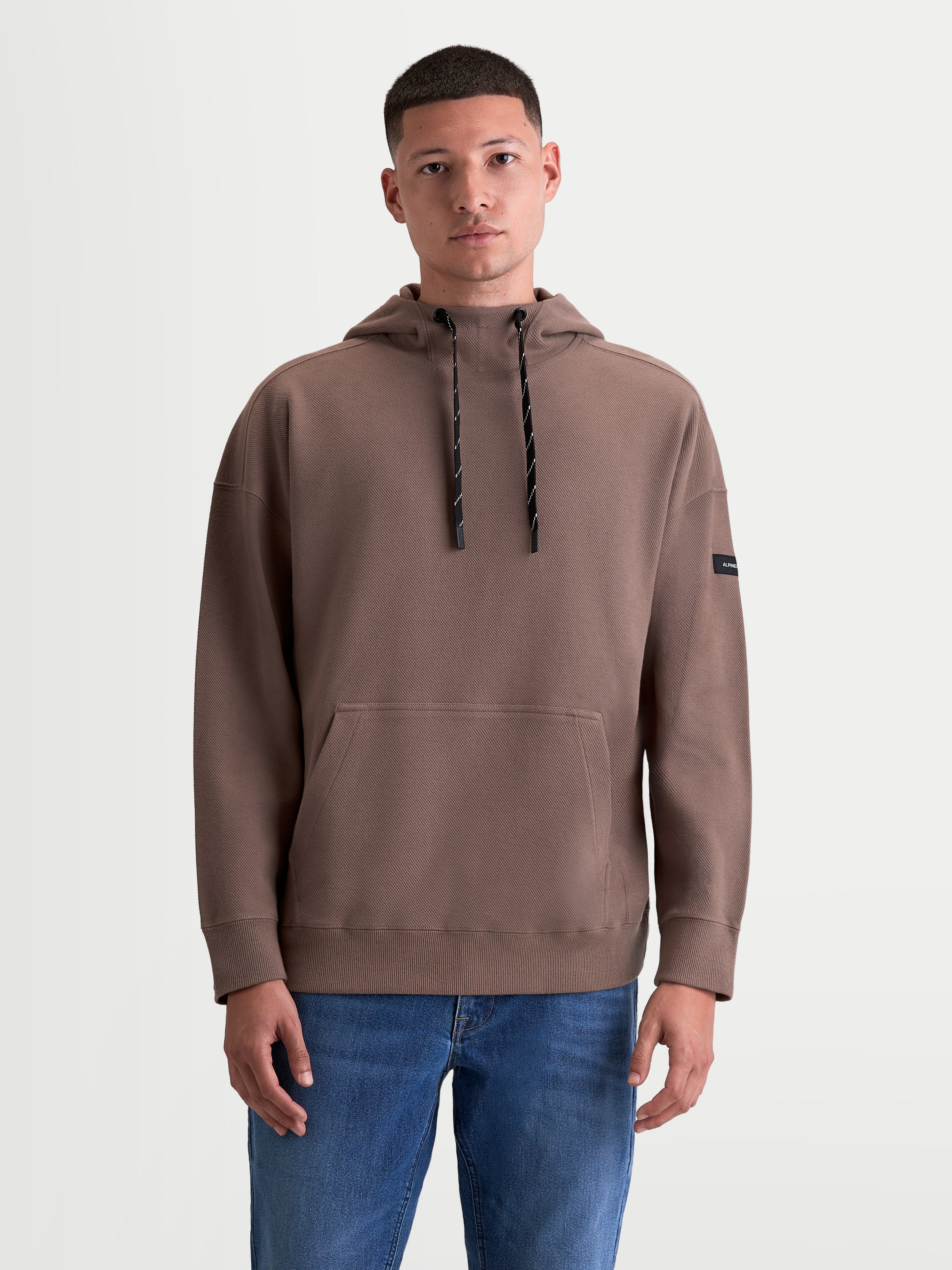 Alpinestars Camino Textured Oversized hoodie, bruine sportswear-pullover voor heren en dames, gestructureerde knit twill fleece met hoge kraag en kangoeroezak, casual stijl geïnspireerd door motorsport.