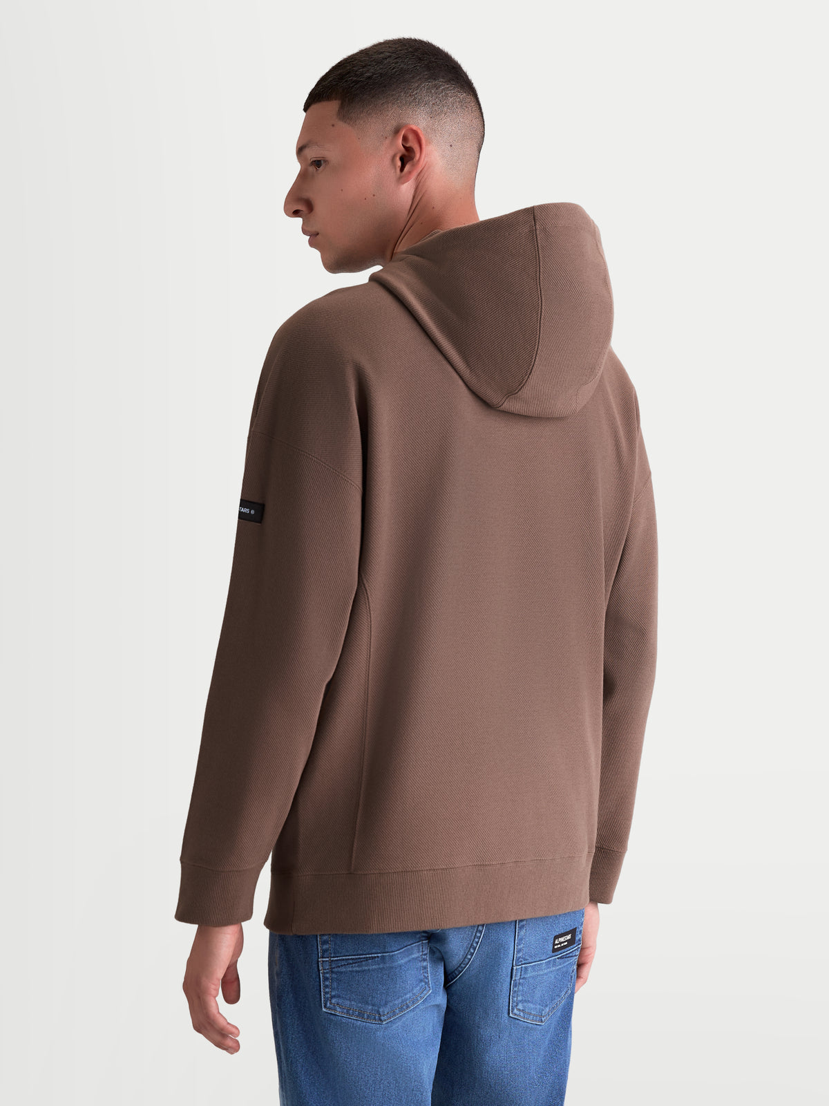 Alpinestars Camino Textured Oversized Hoodie, Men's and Women's Casual Sportswear Pullover, Taupe Brown, Textured Knit Twill Fleece, Back View showing Relaxed Fit and Sleeve Branding