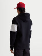 Alpinestars Sweat à capuche Cubic, pull en polaire sportswear, noir et blanc, avec blocs de couleur sur les manches, mélange de coton et polyester recyclé, vue de dos sur modèle pour un style quotidien.