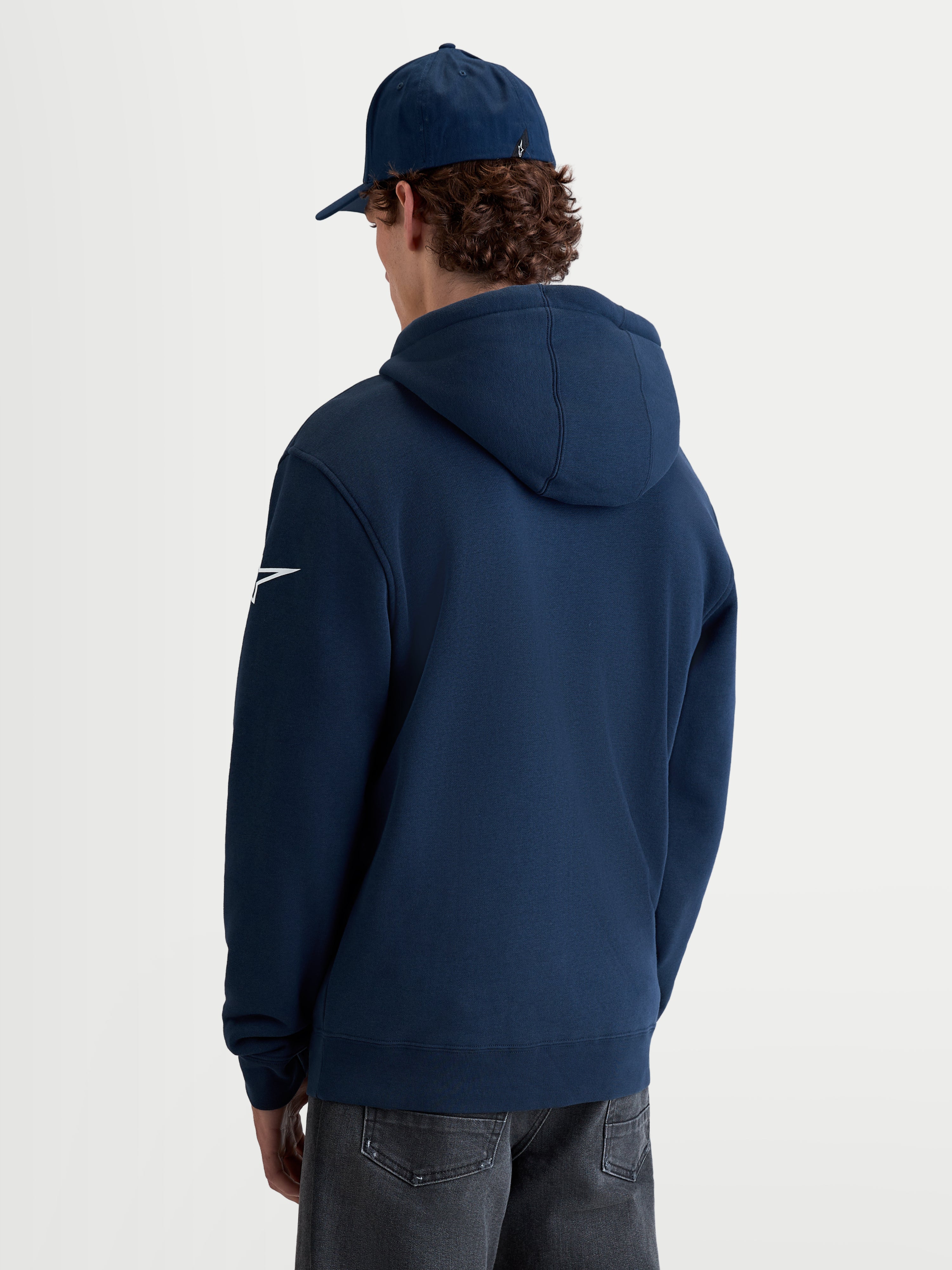 Alpinestars Race Wordmark Hoodie, Men's Sportswear Pullover Fleece, Navy Blue and White, back view on-model featuring a white Ageless sleeve logo and self-lined hood.