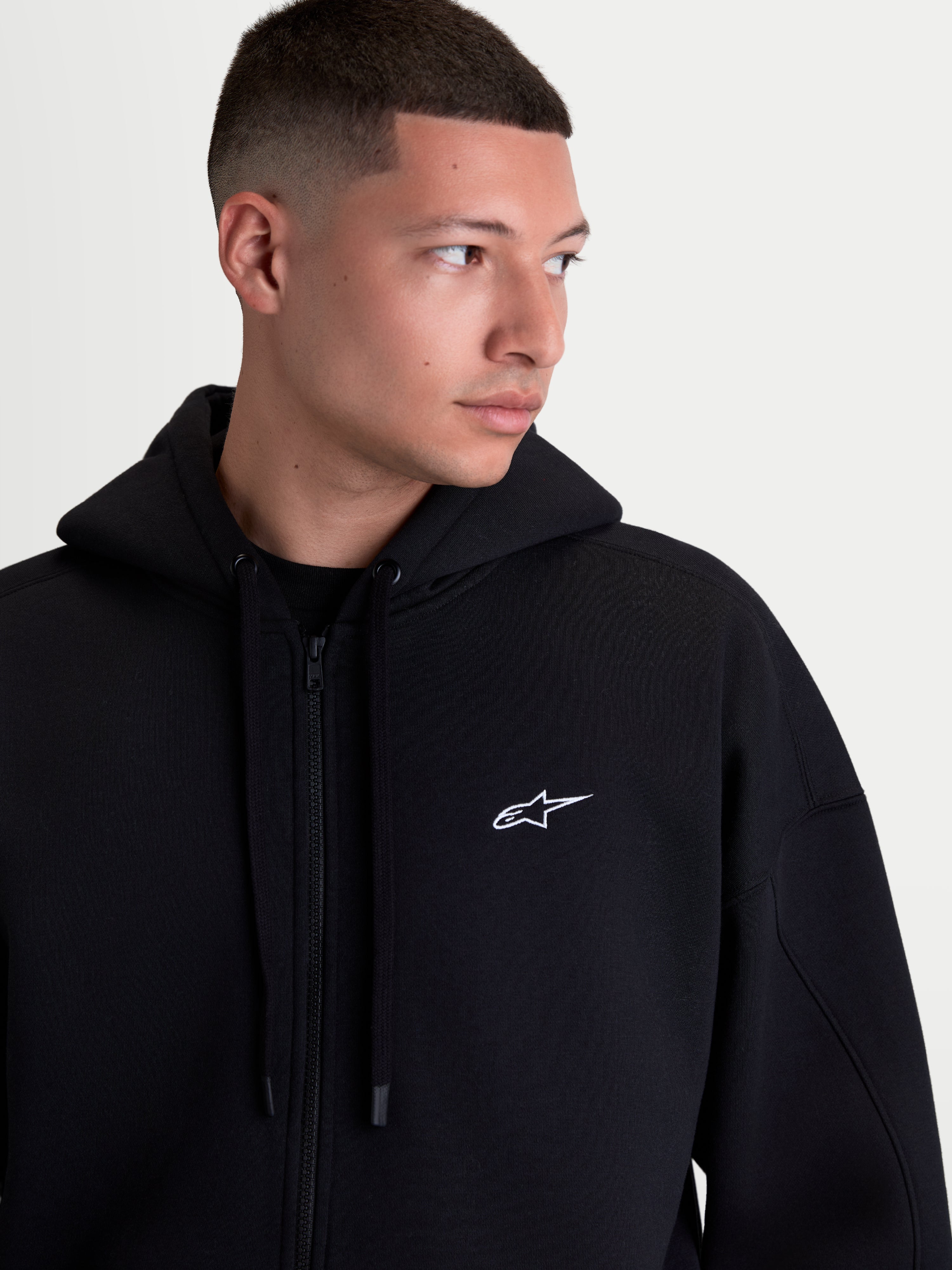 Alpinestars Sweat À Capuche Pioneer Oversize, sweat à capuche zippé sportswear en polaire pour homme, noir avec logo Astars blanc brodé sur la poitrine, fermeture éclair Vislon, coupe oversize décontractée