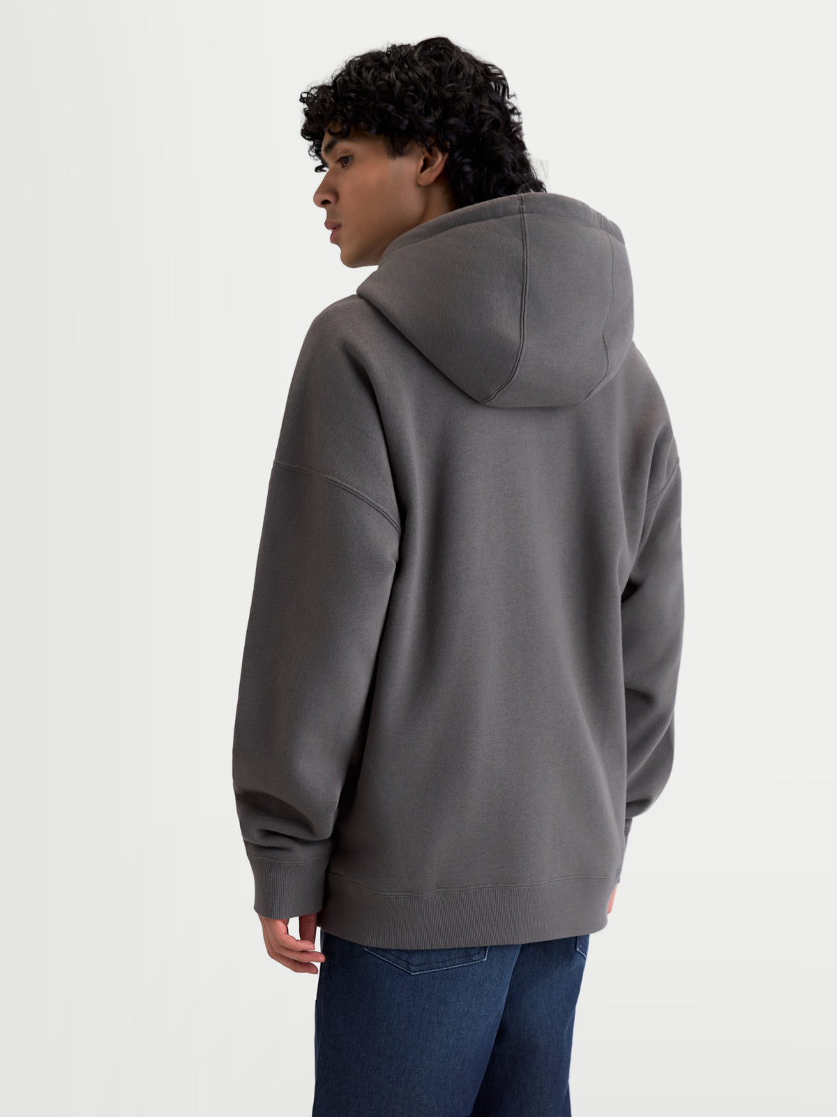 Alpinestars Entity Oversized Hoodie, Full-Zip Sportswear Fleece in Charcoal Gray, Men's and Women's Casual Outerwear, Back View on Model showing Relaxed Silhouette and Ribbed Hem