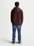 Alpinestars sweat à capuche Entity Oversized, sweat à capuche zippé sportswear marron, vue de dos sur modèle, coupe décontractée oversized, polaire en coton recyclé premium, vêtement casual lifestyle.