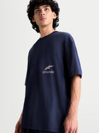 Alpinestars Institute Oversized SS CSF Tee, t-shirt sportswear à manches courtes pour homme, bleu marine, coupe oversize décontractée avec logo Alpinestars et texte One Goal One Vision sur la poitrine, mélange coton et polyester.