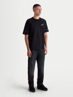 Alpinestars Mandate Oversized CSF, t-shirt à manches courtes pour homme, noir avec logo Astars blanc en impression puff sur la poitrine, coupe ample et décontractée, style sportswear